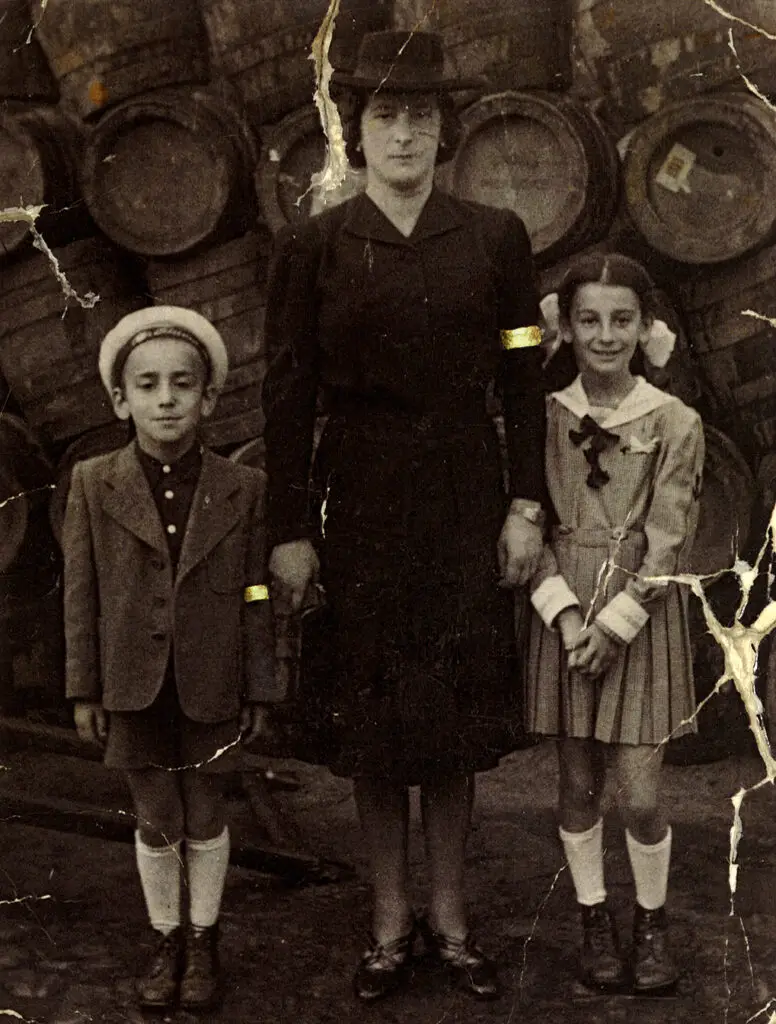 Emil Fish with his mother, Leah, and sister, Anna, at a wedding in Bardejov in 1941 or 1942